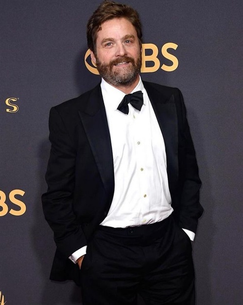 A noticeably slimmer Zach Galifianakis walks the red carpet at Emmys