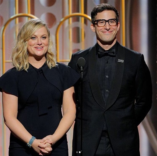 Amy Poehler on stage with Andy Samberg