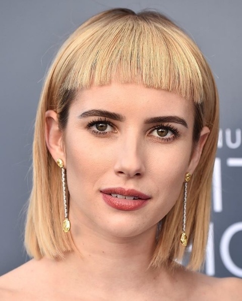 Emma Roberts dares to be different with blunt bangs at the Critics Choice Awards