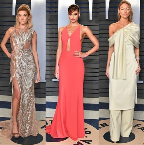 Hailey Baldwin in Atelier Versace, Taylor Hill in Narciso Rodriguez, Martha Hunt in Marina Moscone