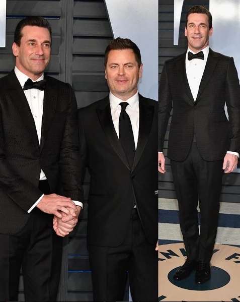 Jonn Hamm in Zegna holds hands with Nick Offerman